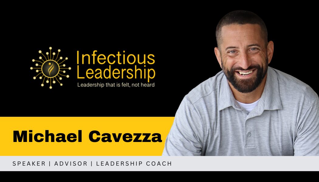 Business card with logo, name, and title of Michael Cavezza, smiling man in gray shirt, black background.