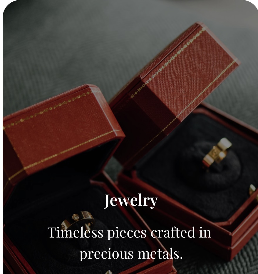 Open jewelry box with rings inside, on a textured surface, with text about jewelry and metals.