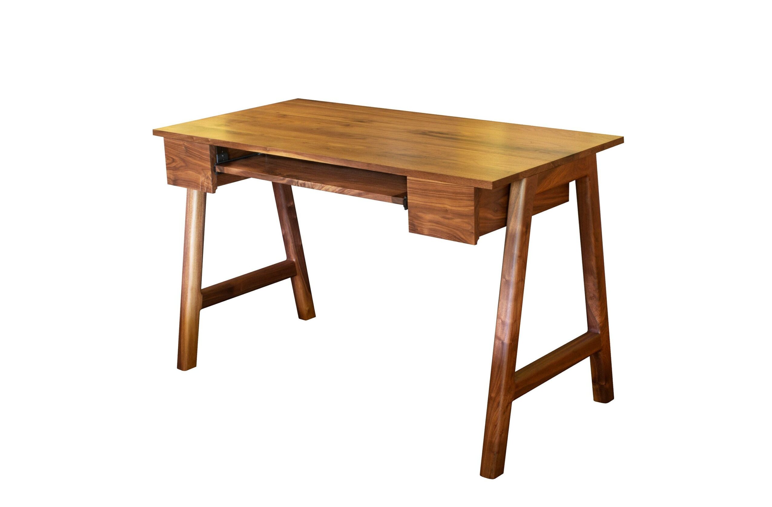 Wooden desk with a flat top and four angled legs, isolated on white background.