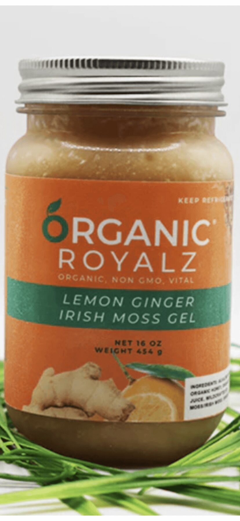 Jar of Organic Royalz Lemon Mander Irish Moss Gel with orange label, placed on green grass, with a white background.