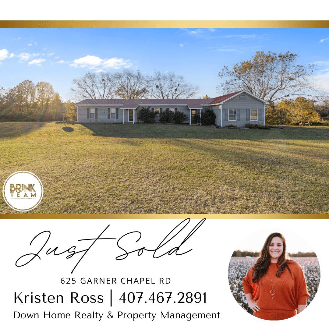 Single-story house with a large lawn, trees in the background, and a clear sky. Text indicates the house is sold.