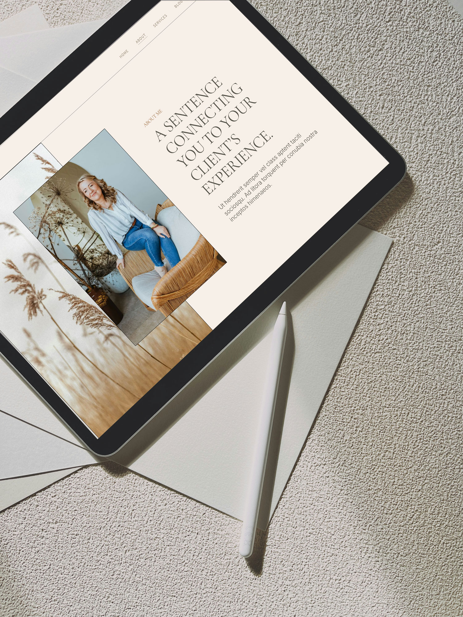 Tablet displaying a woman sitting on a sofa with text about a sentence connecting to an experience, placed on a white surface with a stylus.