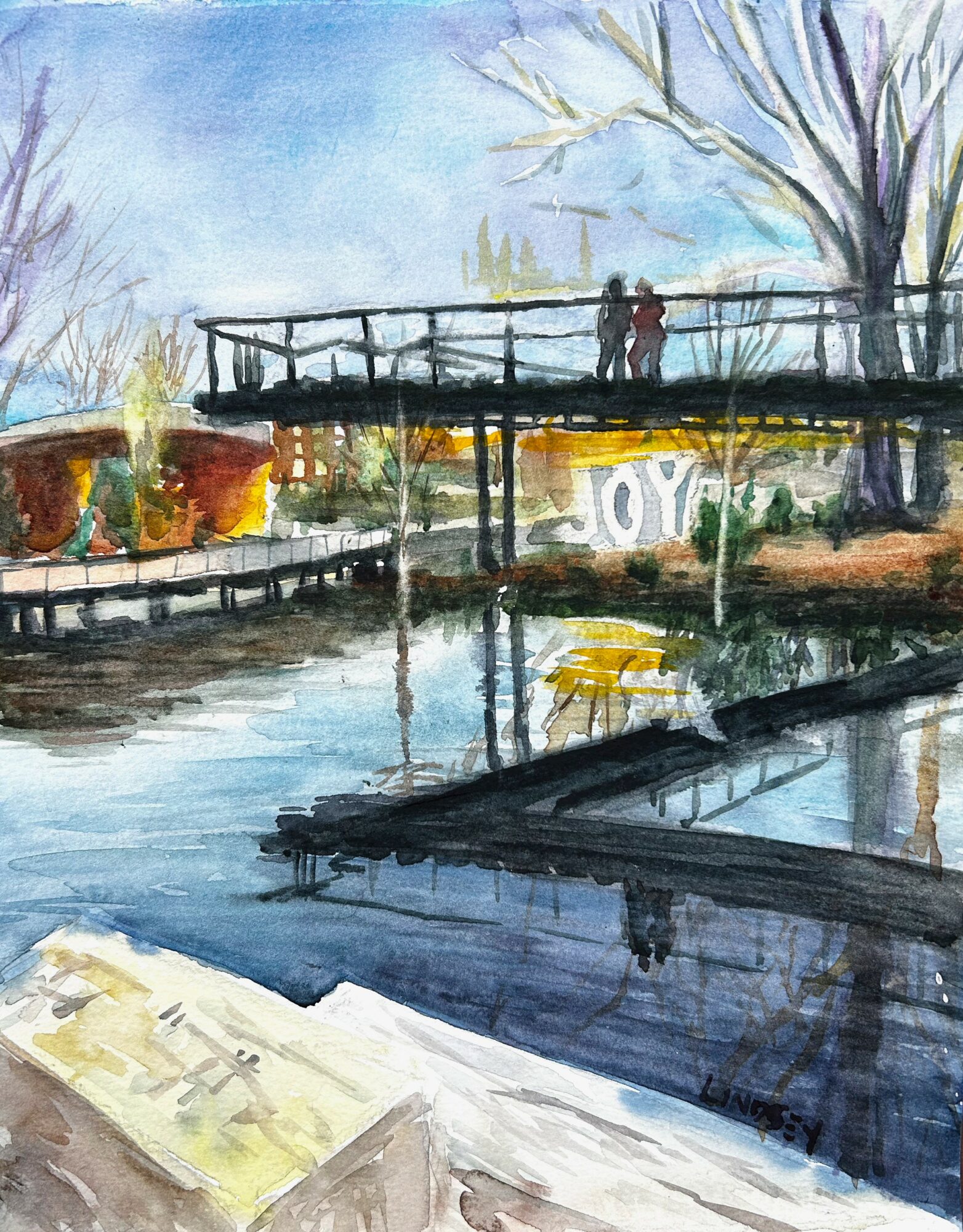 Watercolor painting of a bridge over a river with trees and a person standing on the bridge, sky in background.