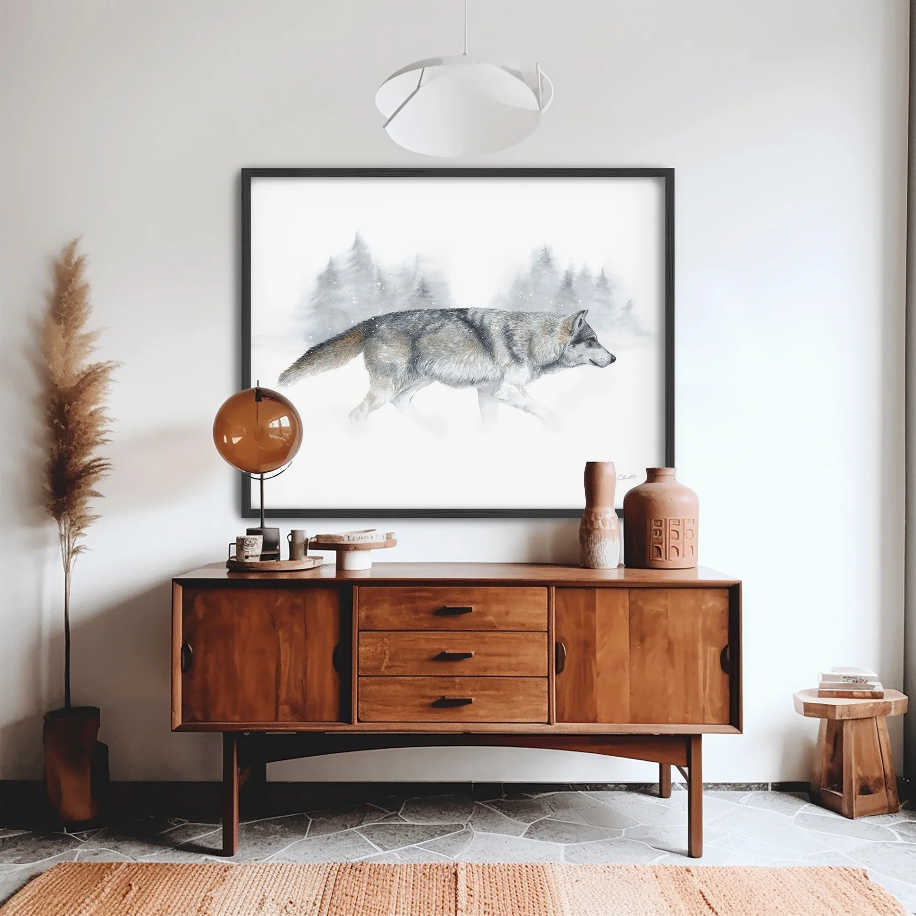 Upright wooden sideboard with decorative items and a framed wolf watercolor painting above it, in a modern room.