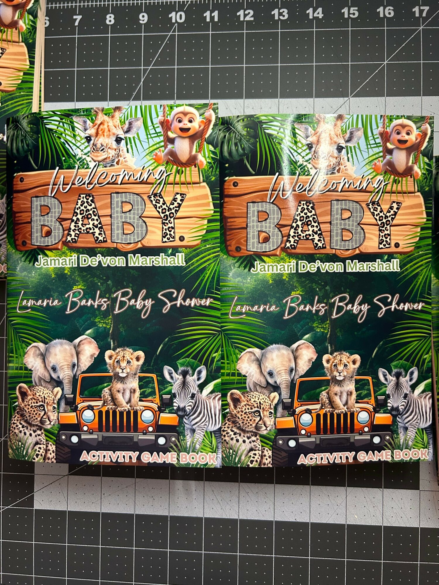 Three colorful jungle-themed banners with animals and the word 'BABY' in large letters, featuring lions, zebras, and elephants.
