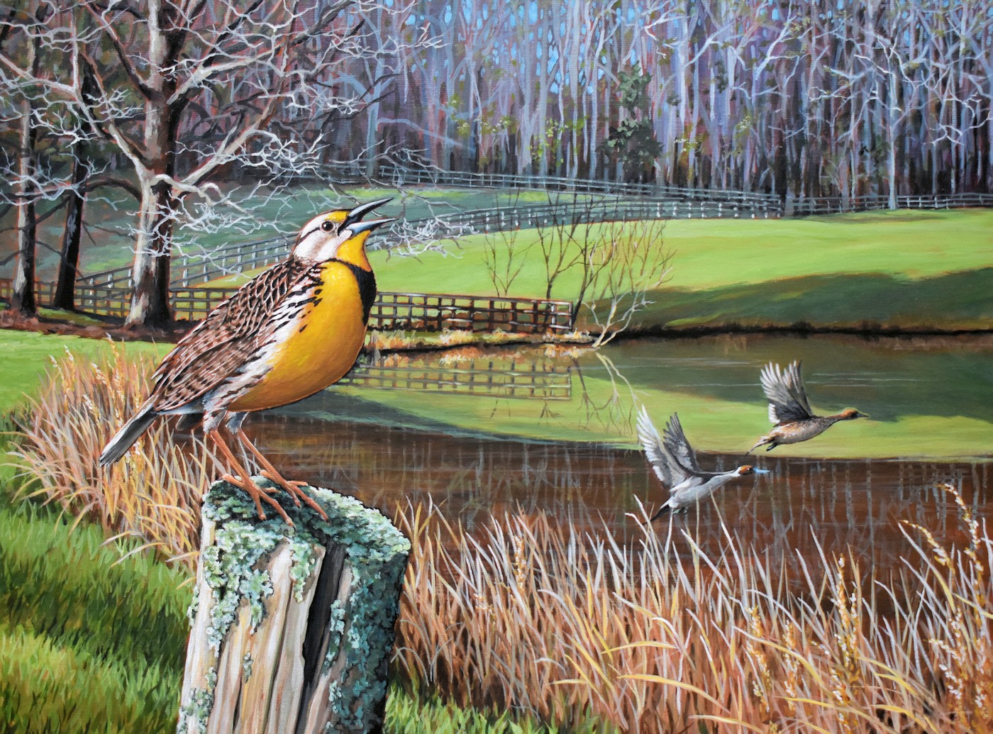 A yellow-breasted bird perched on a tree stump near a pond with two birds flying above, trees in the background.