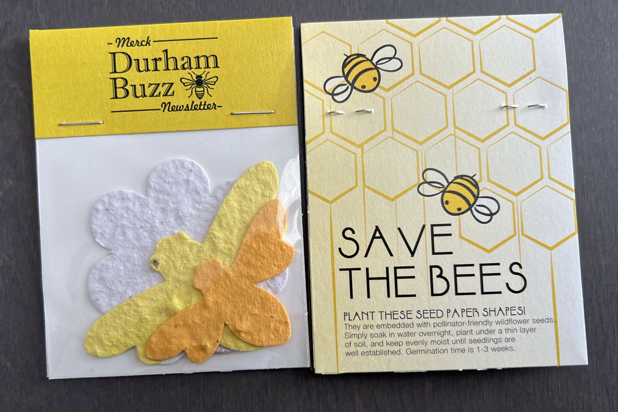 Two paper bee and honeycomb designs, one with a yellow and orange butterfly, and the other with bees and honeycomb pattern.
