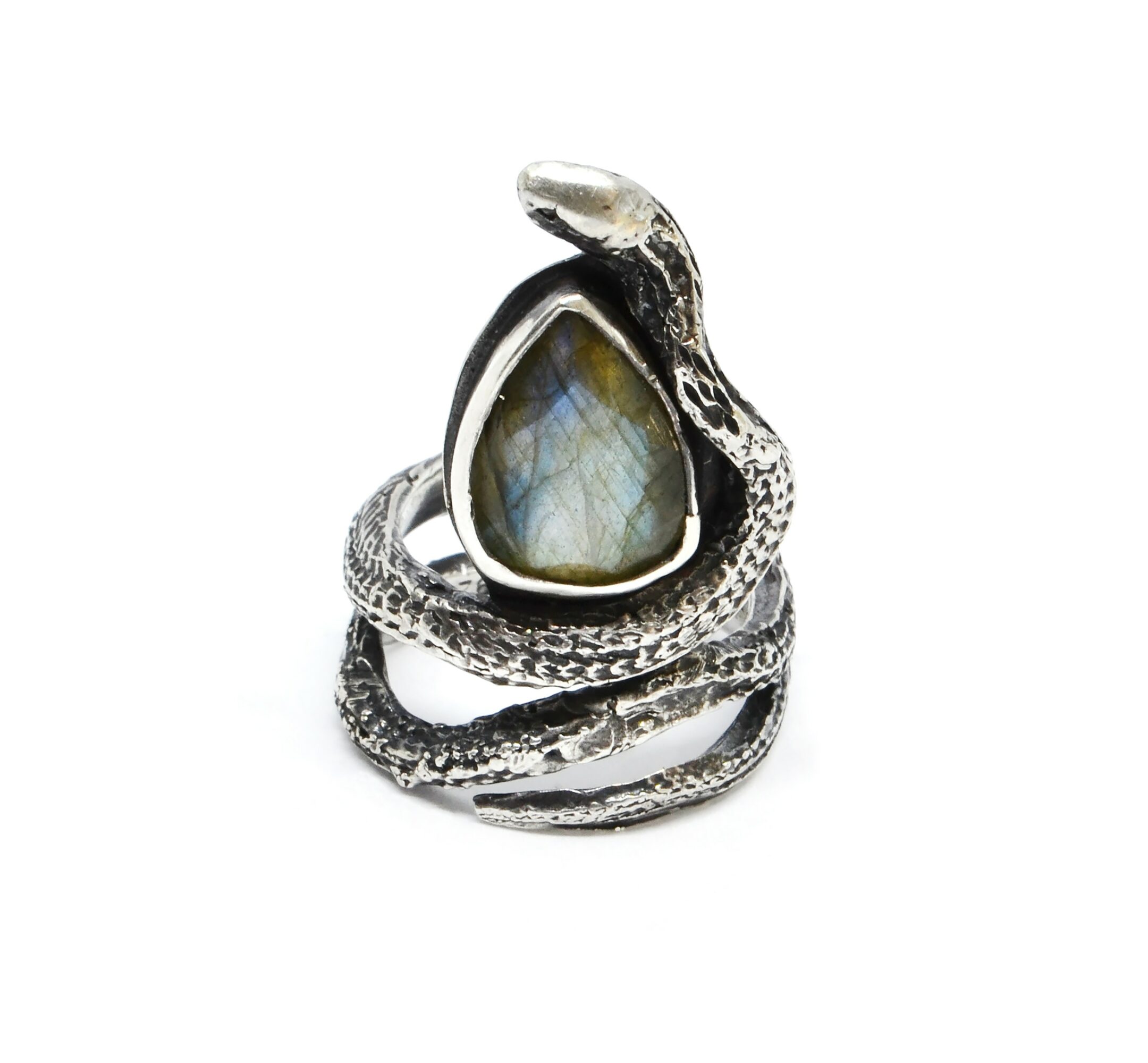 Ring with a snake design and a large teardrop-shaped gemstone, silver-colored, coiled around itself, on a white background.