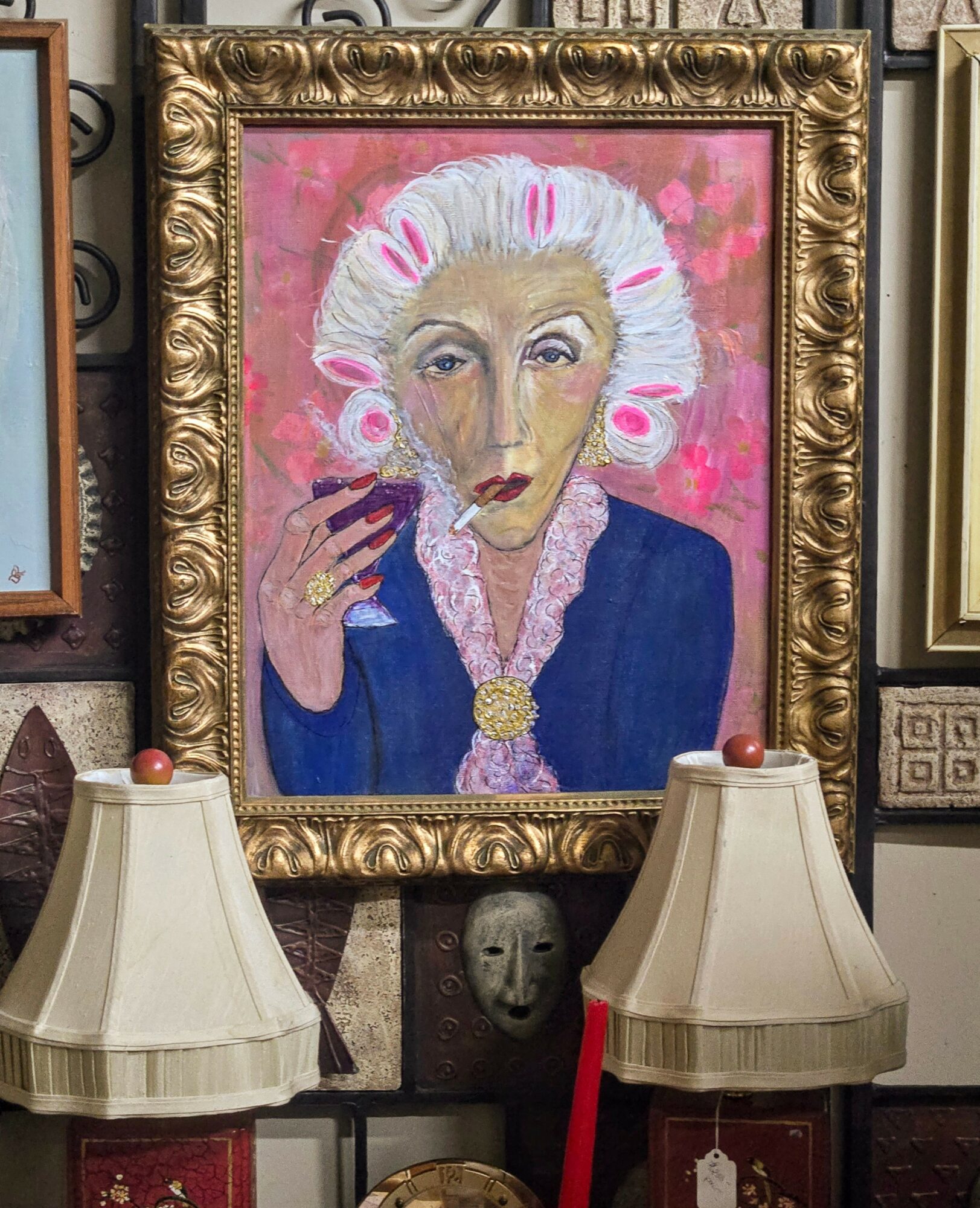 Painting of a woman with white hair, pink rollers, wearing a blue outfit, holding a cigarette, framed in an ornate gold frame.