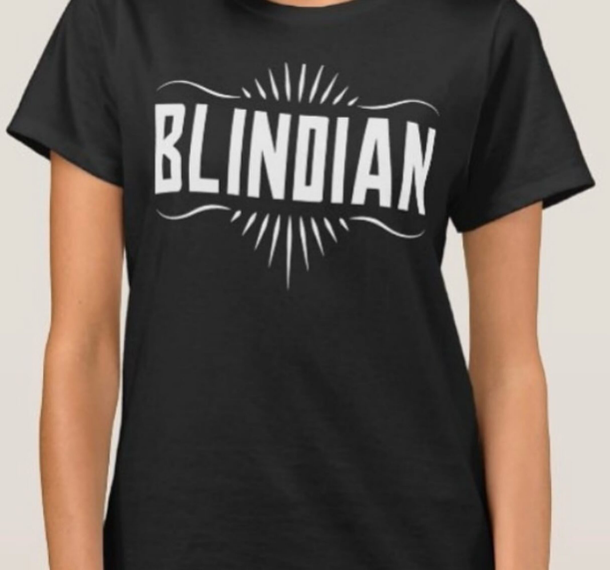 Person wearing a black T-shirt with the word 'BLINDIAN' in white text, centered on the chest.