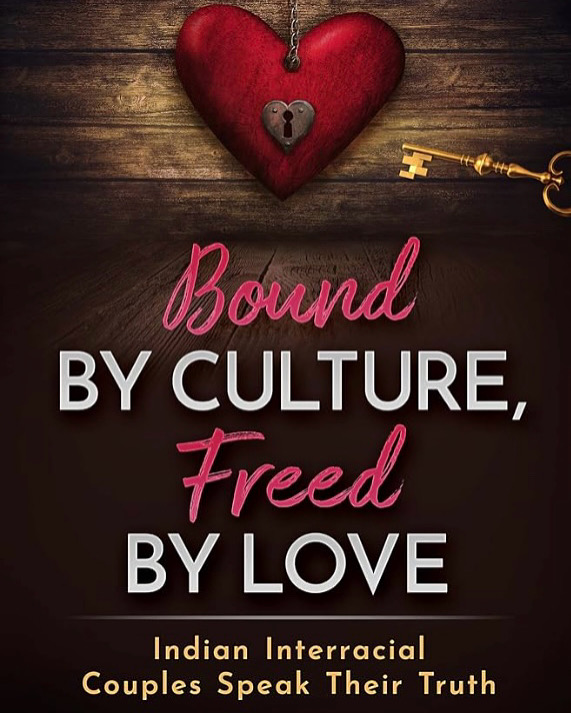 Heart-shaped lock with a key, text reads 'Bound by culture, freed by love,' on a wooden background.