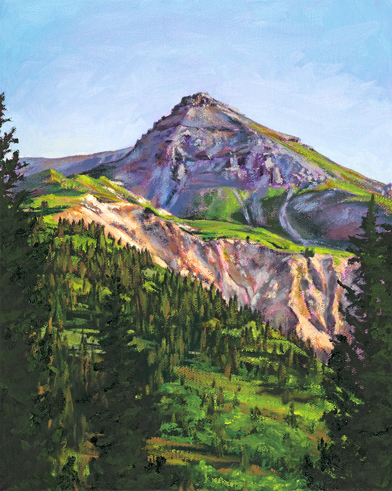 Mountain with green slopes and rocky peaks under a blue sky, surrounded by trees.