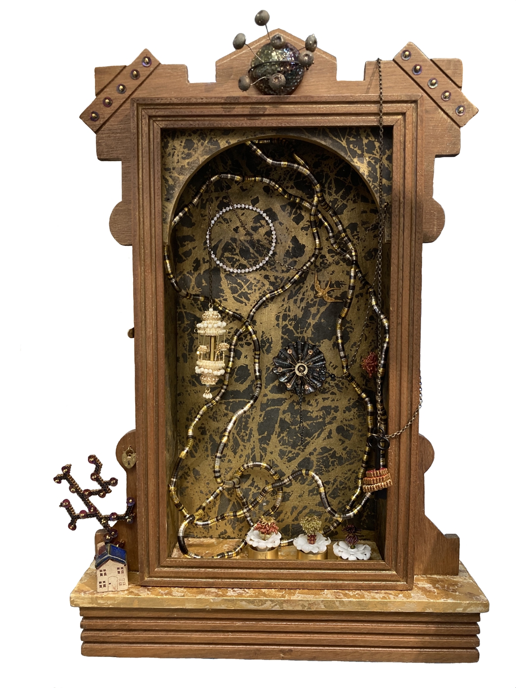 Wooden clock with glass front, gears and decorative elements inside, small figurines at the base, and a small tank on top.