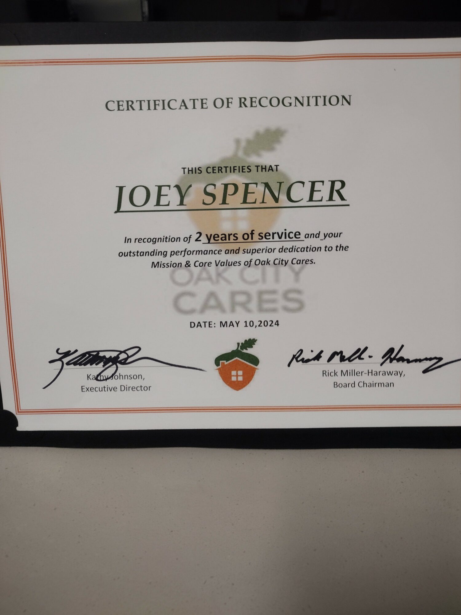 Certificate of recognition awarded to Joey Spencer for 2 years of service, dated May 10, 2024, with signatures and logos.