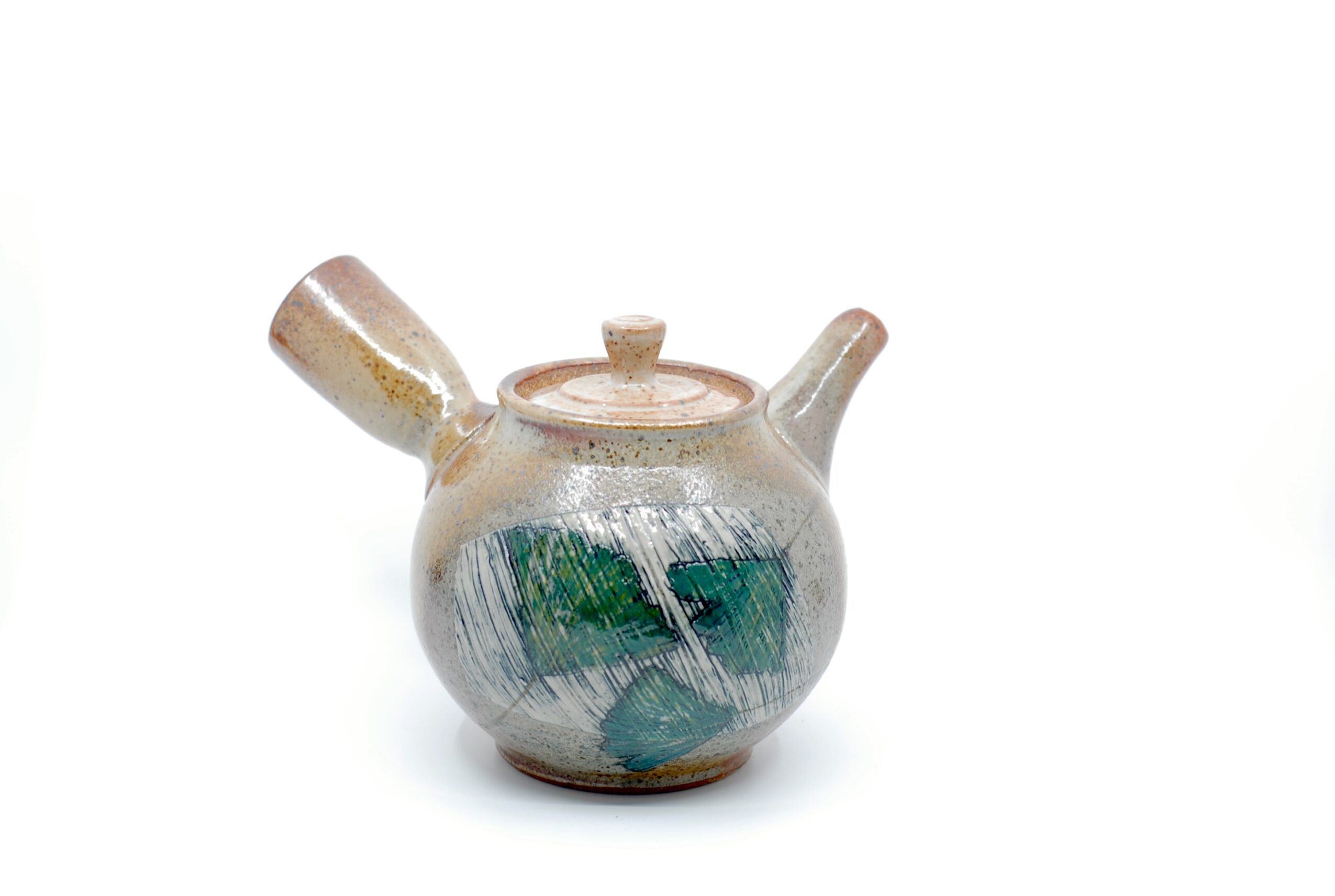 Round ceramic teapot with a handle, spout, and lid, decorated with green and blue brushstrokes, on a white background.