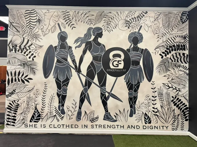 Silhouettes of three women holding shields and weapons, surrounded by leaves, with a quote at the bottom.