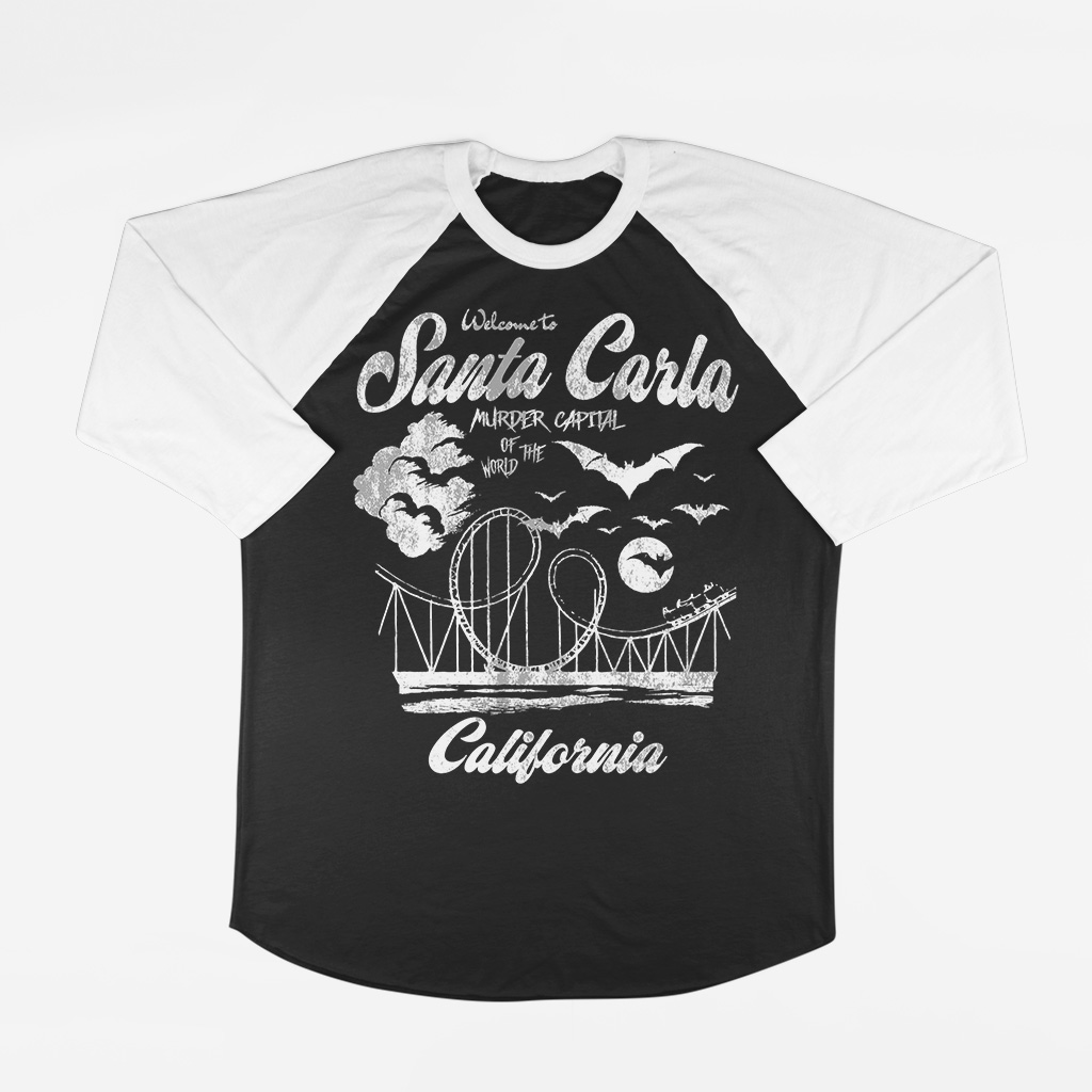 Black and white baseball-style shirt with Santa Carla, California, text and a graphic of a roller coaster, bats, and a moon.