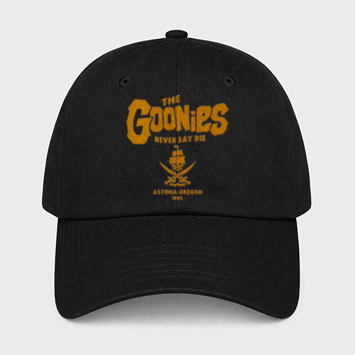 Black baseball cap with yellow text and logo, featuring 'The Goonies' and 'Never Say Die' with a skull and crossbones design.