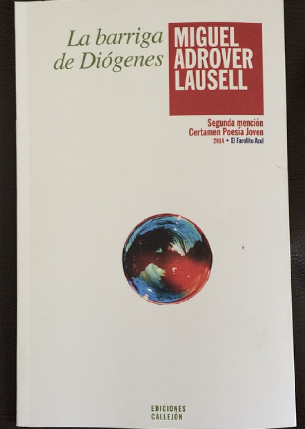 Book cover with title 'La barriga de Diógenes' and author's name 'Miguel Adrover Lausell', featuring a small circular image of Earth.