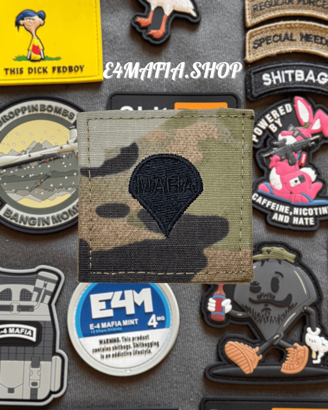 Camouflage wallet with black embroidered patch, surrounded by various colorful patches and stickers, some with text and cartoon characters.