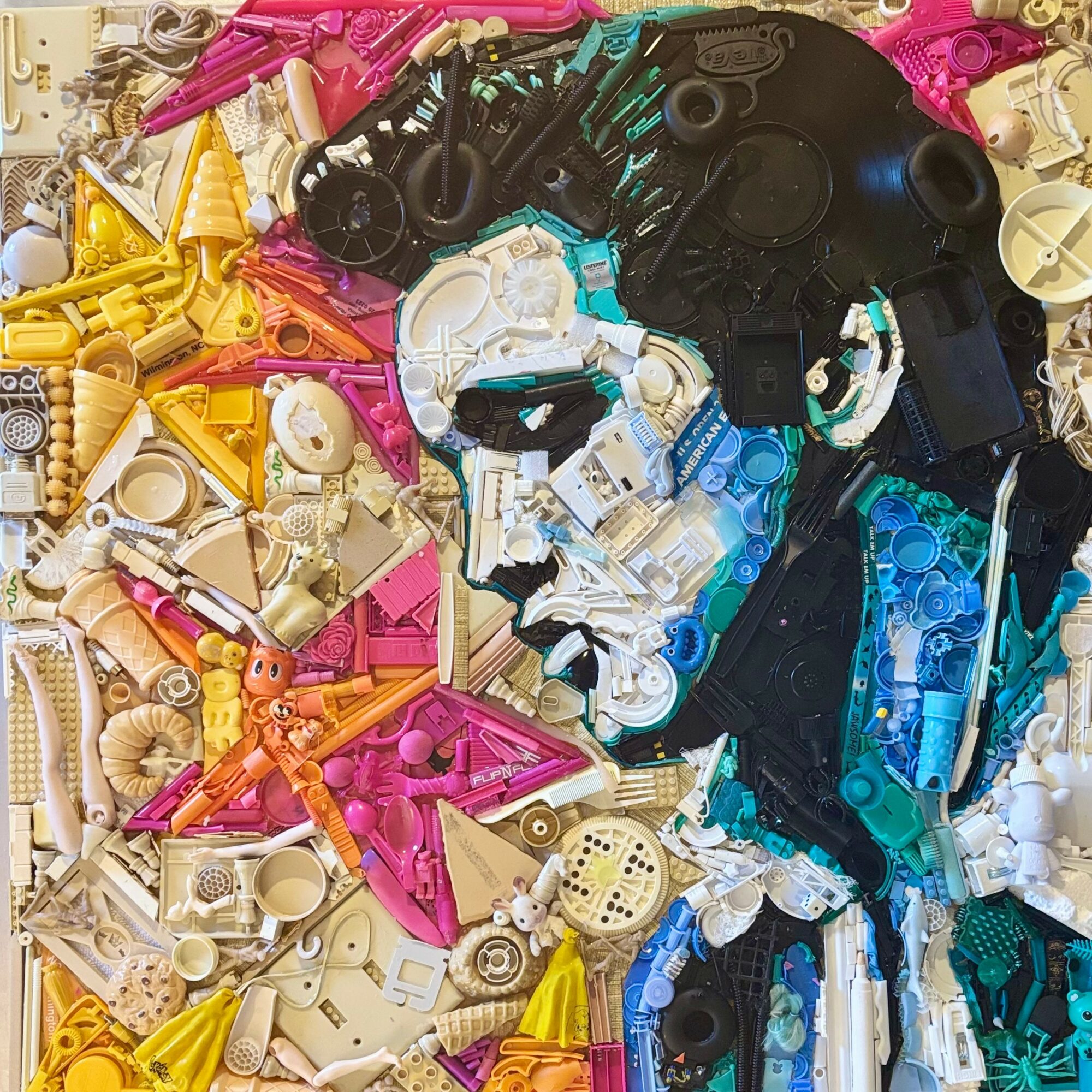 Portrait of a person made from colorful LEGO bricks, with a focus on the face and upper body.