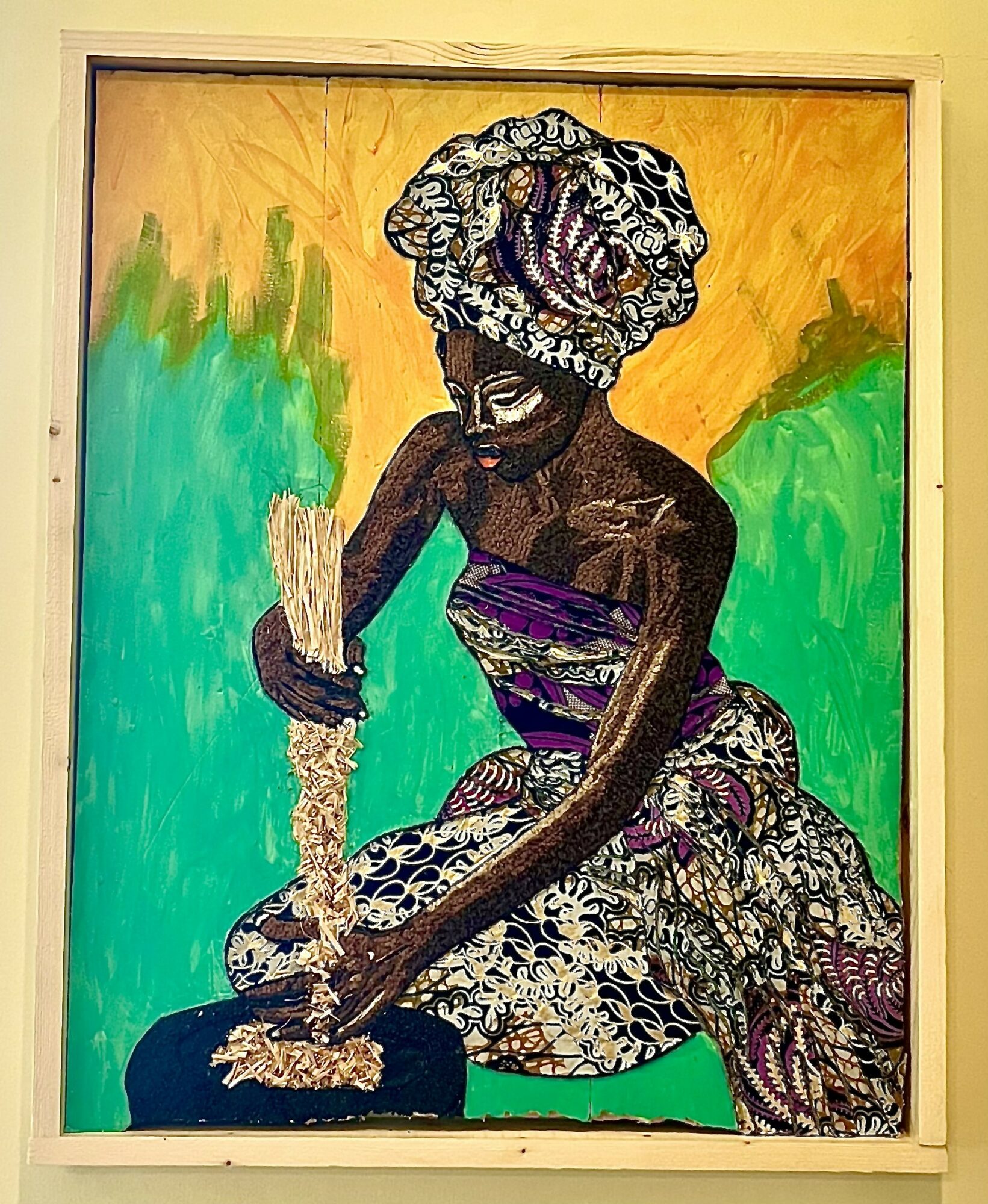 Painting of a woman with a patterned headwrap, holding a broom, sitting against a colorful background.