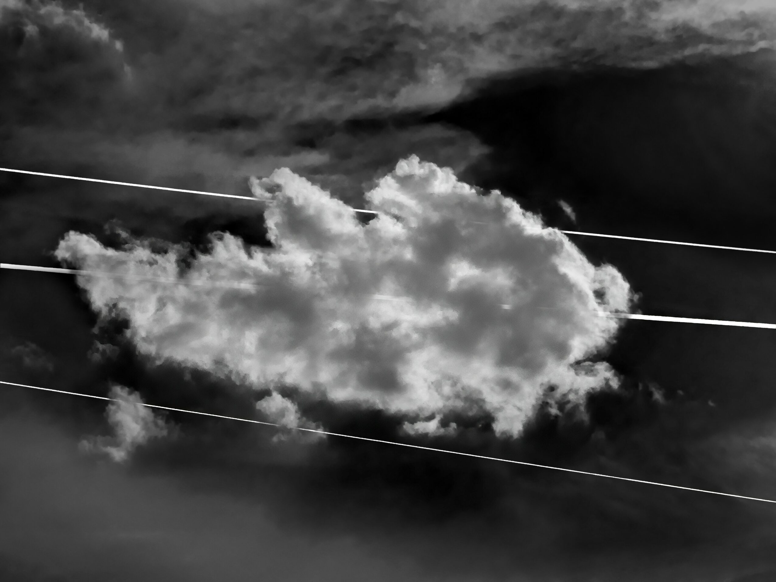 Clouds in the sky with power lines crossing in front, black and white image.