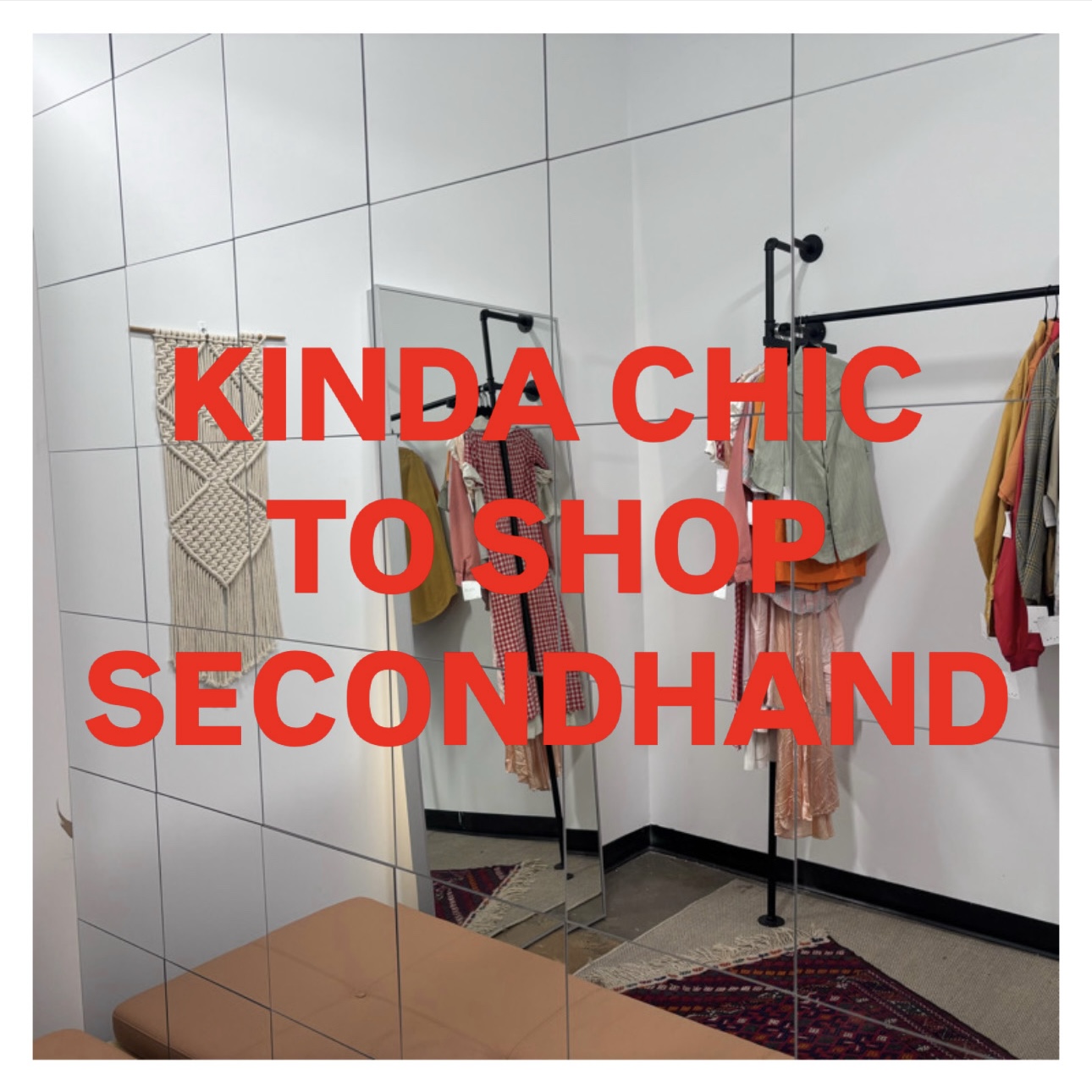 Clothing racks with secondhand clothes in a store fitting room, mirror, and a bench, with red text overlay. Word count: 20