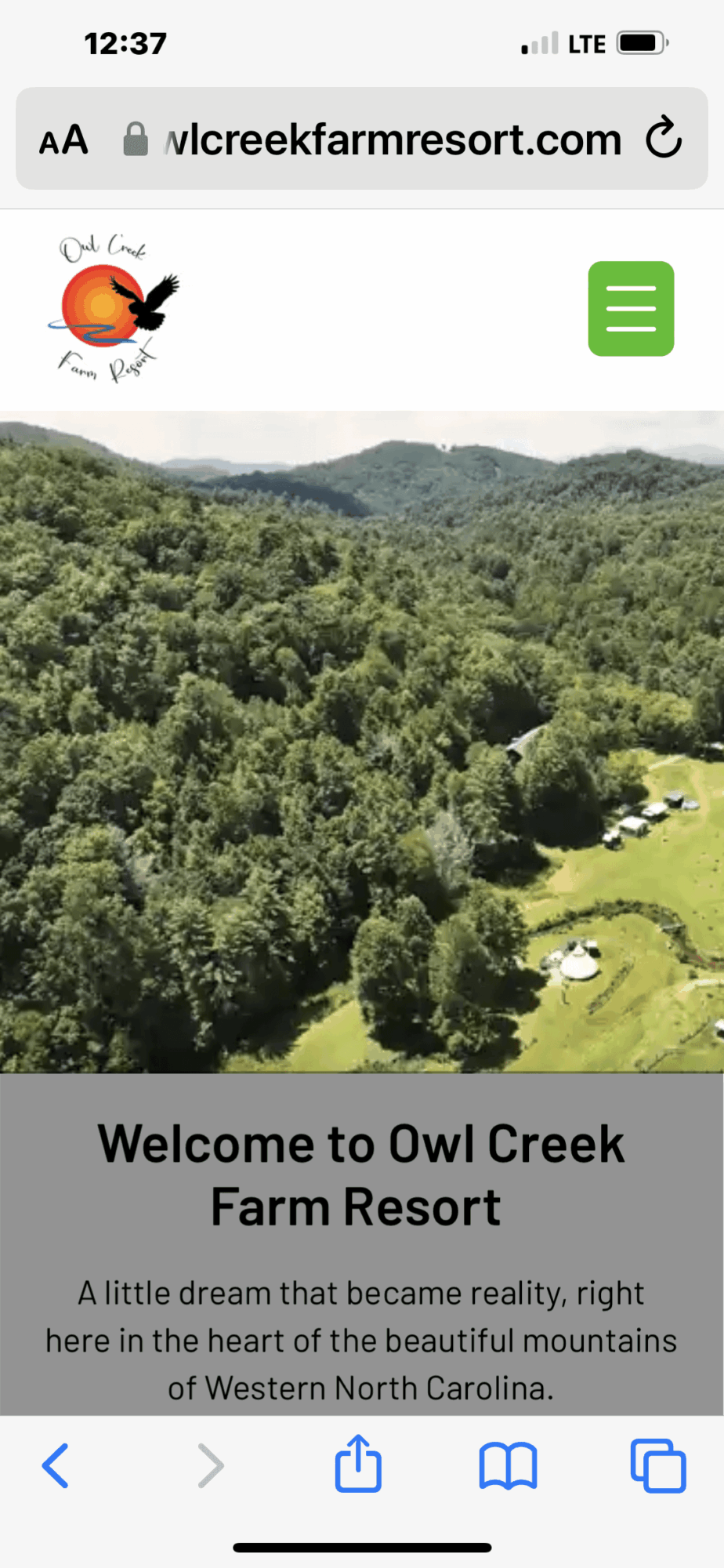 Landscape view of green mountains and trees with a small farm area, welcoming message for Owl Creek Farm Resort.