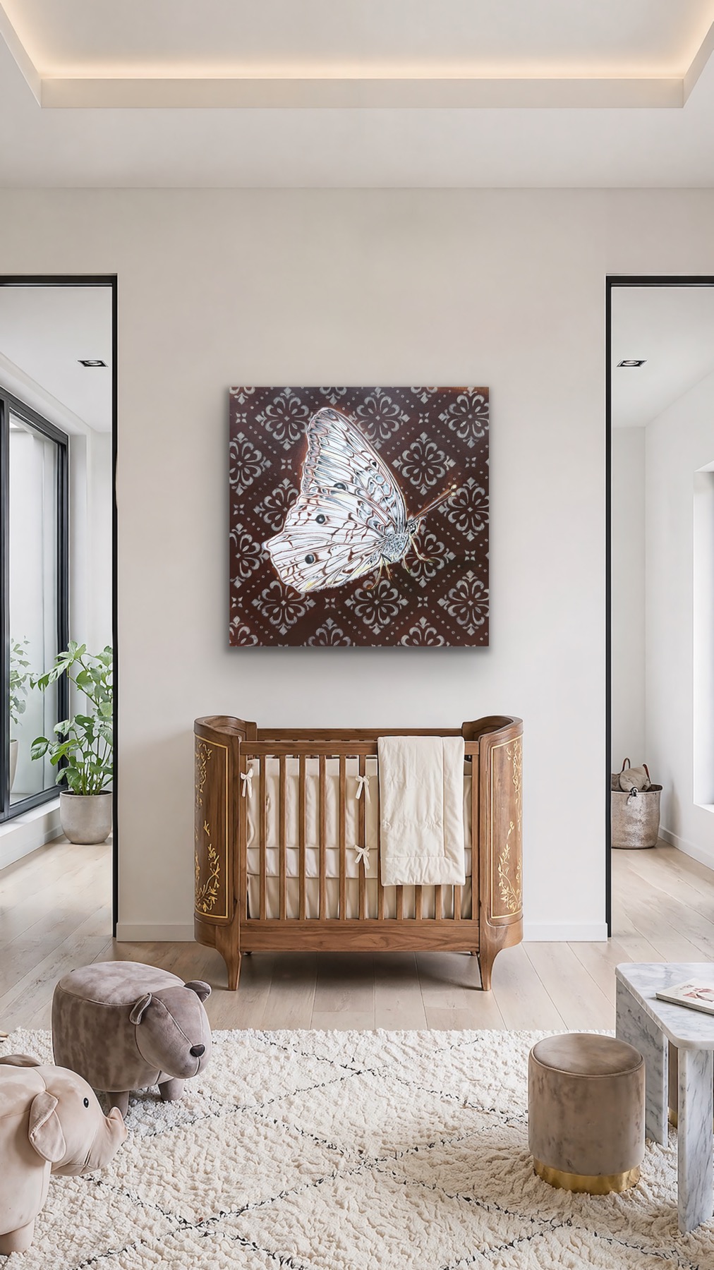 Wooden crib with a white towel, artwork on the wall, and two open doorways in a bright room.