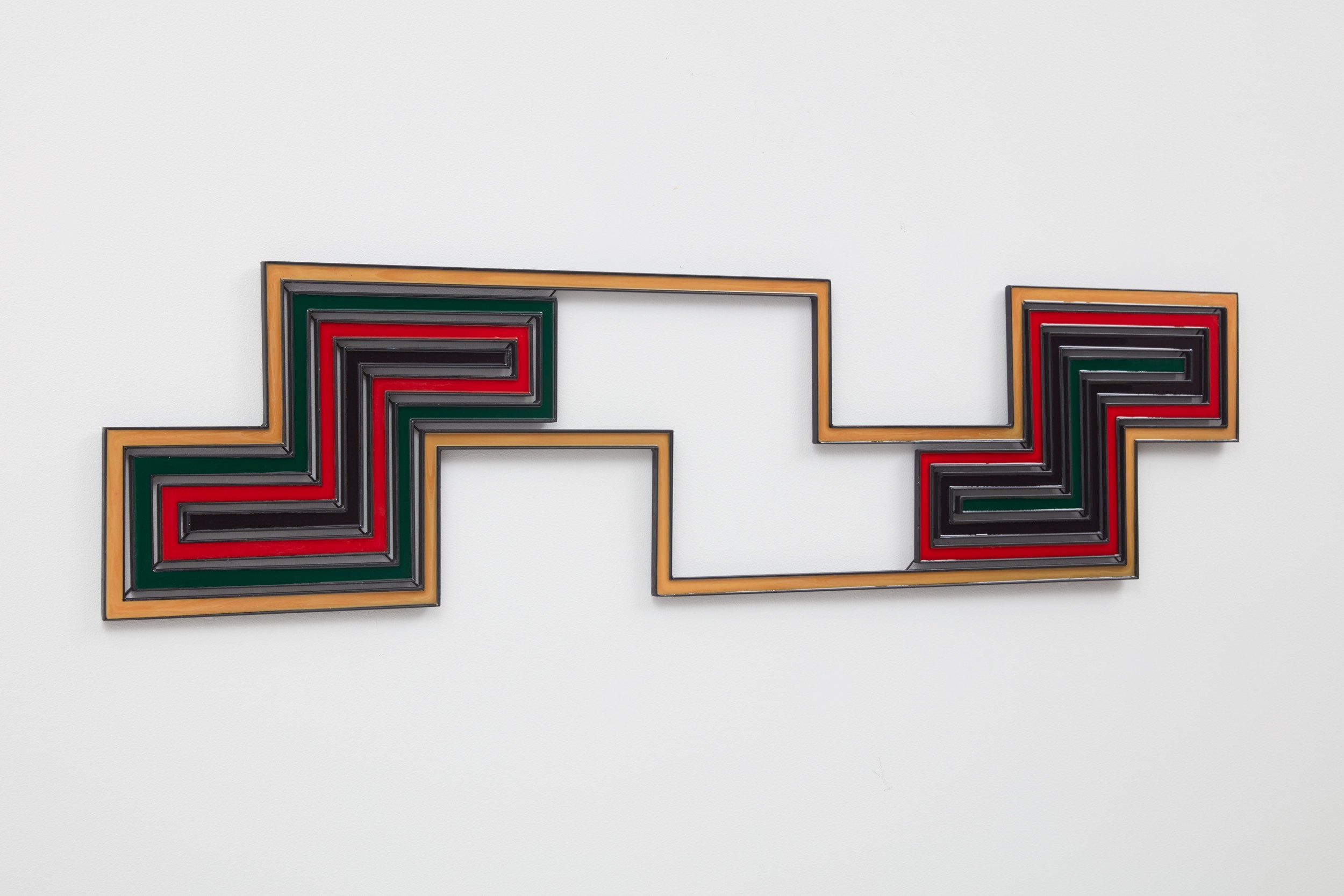 Colorful geometric artwork with interconnected rectangular frames on a white wall.